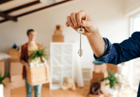 closeup-man-holding-key-his-new-home